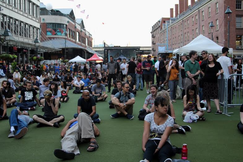 South Street Seaport area. Crowds waiting for a free concert to begin.
