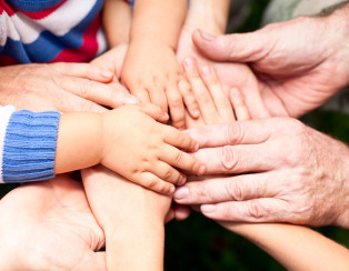 bigstock-Family-holding-hands-together-33759587