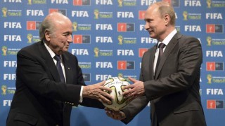 Sepp Blatter and Vladimir Putin at the World Cup handover last July Source: Guardian 