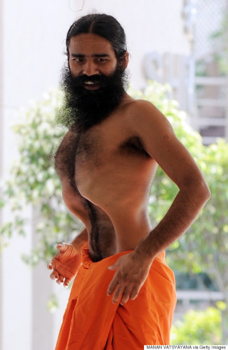 In this file photograph taken on June 7, 2011 Indian spiritual guru Swami Baba Ramdev performs yoga during his hunger strike at the Pitanjali Yogpeeth in Haridwar, some 240kms from New Delhi.  A popular Indian yoga guru whose protest against corruption was crushed by police at the weekend warned on June 8, 2011 of violence and threatened to train an army of 11,000 followers. Swami Ramdev, also known as Baba Ramdev, issued the call-to-arms from his ashram near the holy town of Haridwar 130 miles (200 kilometres) north of New Delhi after he was ejected from the capital.  AFP PHOTO/ Manan VATSYAYANA/FILES (Photo credit should read MANAN VATSYAYANA/AFP/Getty Images)
