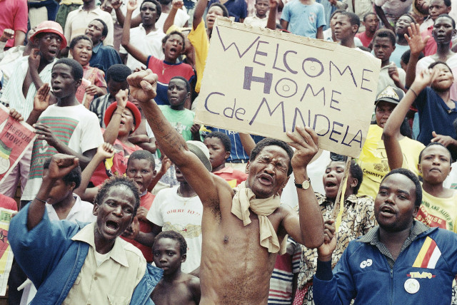 Some of the 20,000 jubilant ANC supporters who gathered on Sunday, Feb. 11, 1990 in Soweto, South Africa at Jabulani Stadium to celebrate the release of ANC leader Nelson Mandela. (AP Photo/Raymond Preston)