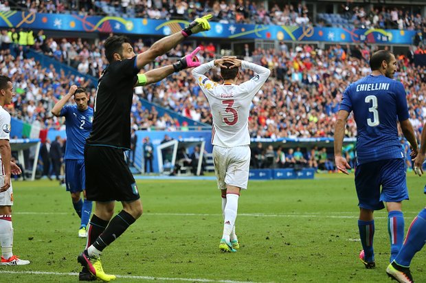 Buffon saves Pique's volley to keep Spain out of reach.