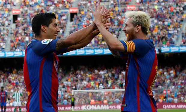 Suarez and Messi celebrate as Barcelona rout Real Betis, with the duo combining for 5 goals.