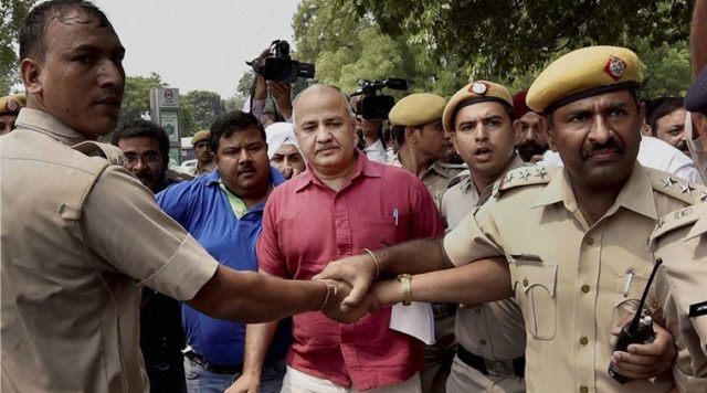 New Delhi: Police detain Delhi Deputy Chief Minister Manish Sisodia and other AAP MLAs at Tughlaq Road Police Station during their march towards Prime Minister's residence to protest against the arrest of party legislator Dinesh Mohaniya, in New Delhi on Sunday. PTI Photo by Kamal Singh (PTI6_26_2016_000068B)