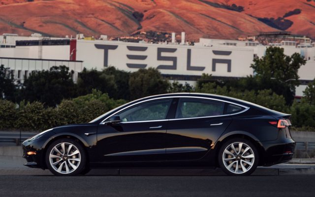 Elon Musk shows off first production Tesla Model 3