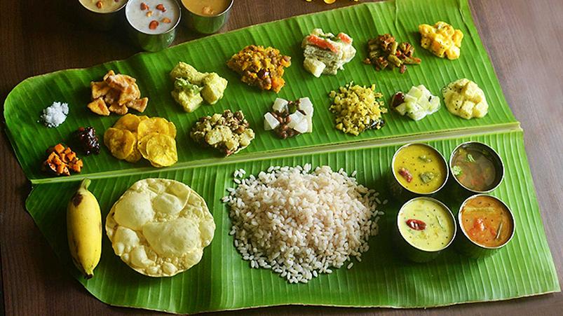 Sadhya - a variety of dishes served with rice on a banana leaf