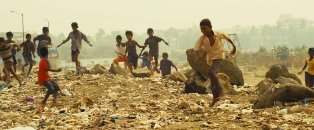 A scene from the Hollywood movie Slumdog Millionaire depicting the waste-strewn slums of Mumbai 