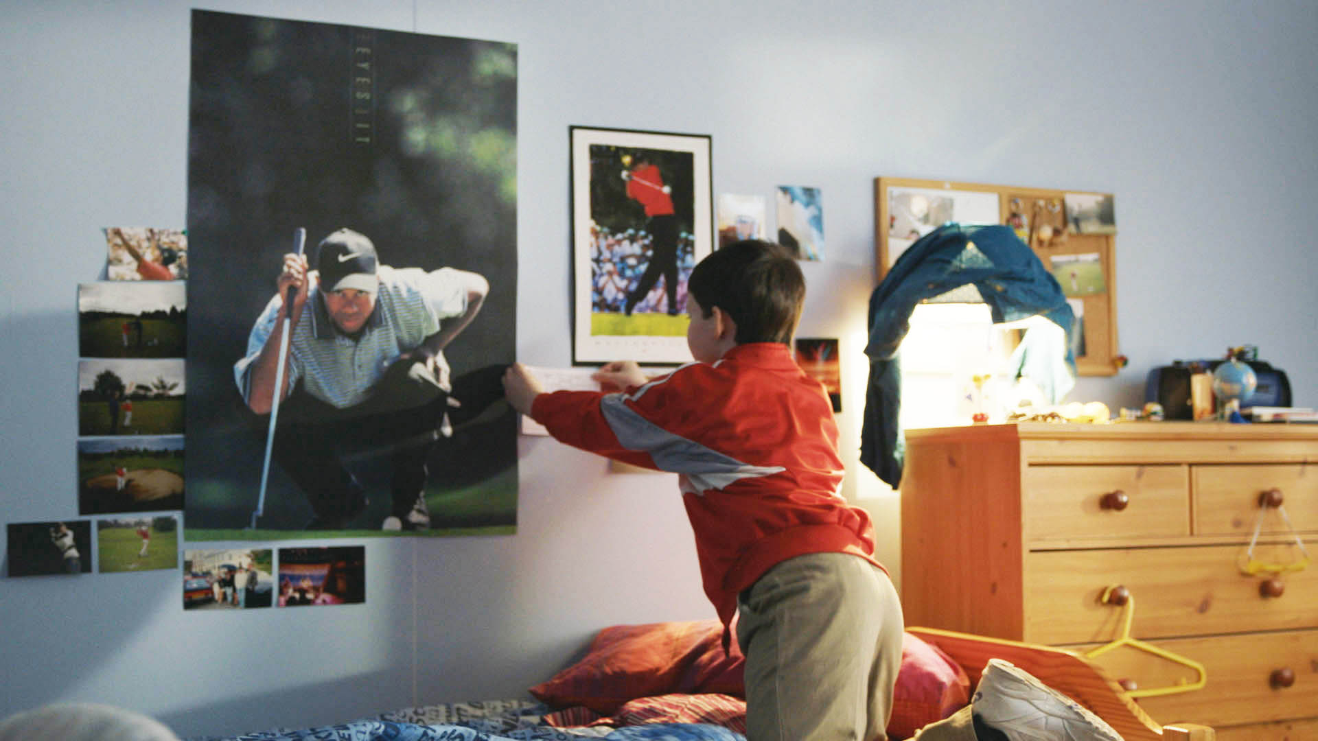 kid putting up posters