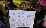 Gay rights activists shout slogans during a protest against the verdict by the Supreme Court in Mumbai